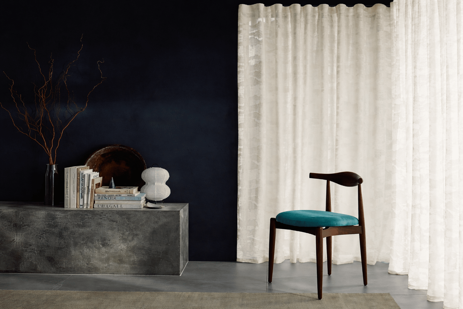 Minimalist living space with navy accents