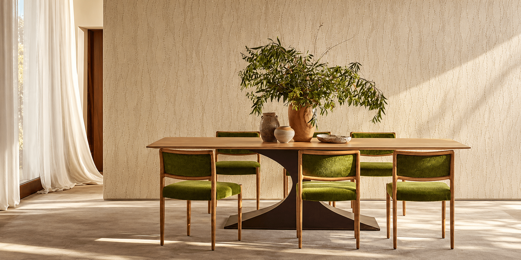 Refined green-upholstered interior in warm light